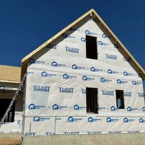 New construction home wrapped in Talbert and Barricade wrap for weather protection