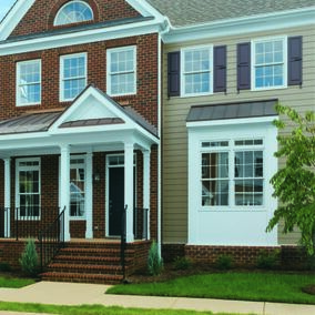 Home exterior featuring CertaTrim with a mix of brick and siding, accented by white trim and shutters