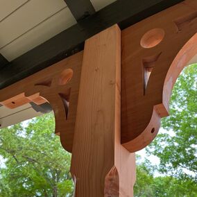 Custom millwork detailing at Talbert Building Supply, showcasing a decorative wood bracket and post